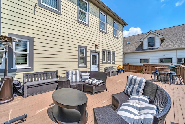 wooden terrace with outdoor lounge area