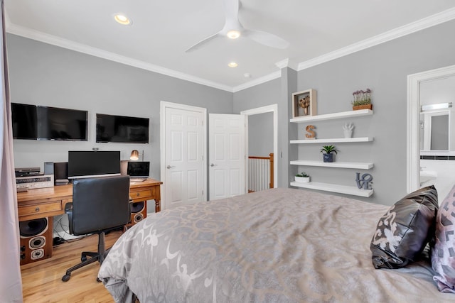 bedroom featuring crown molding, ceiling fan, ensuite bath, and light wood-type flooring