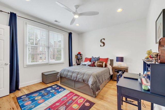 bedroom featuring hardwood / wood-style floors and ceiling fan