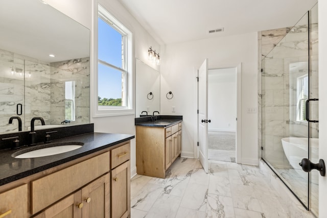 bathroom featuring plus walk in shower, tile patterned flooring, and dual bowl vanity