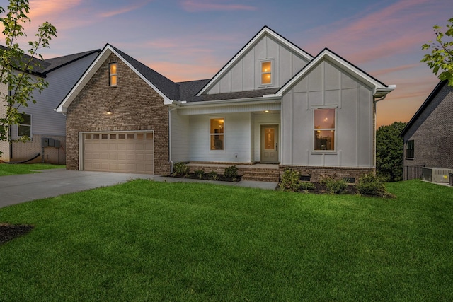 modern farmhouse featuring a garage, concrete driveway, a front lawn, board and batten siding, and brick siding