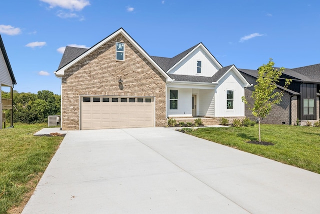 view of front of home featuring a garage, brick siding, concrete driveway, roof with shingles, and a front yard