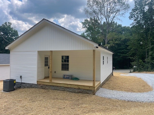 back of property featuring central AC unit