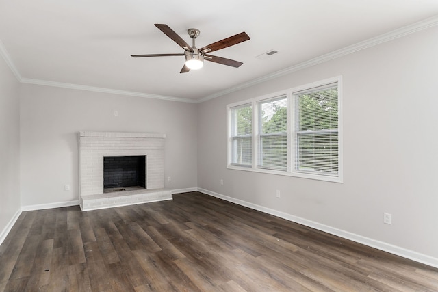 unfurnished living room featuring ceiling fan, wood-type flooring, a brick fireplace, and ornamental molding