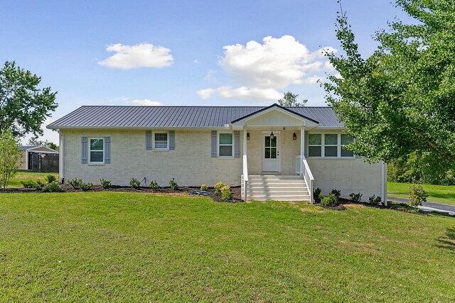 ranch-style house with a front lawn