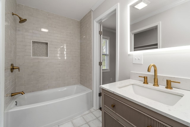 bathroom featuring tile patterned floors, crown molding, tiled shower / bath combo, and vanity