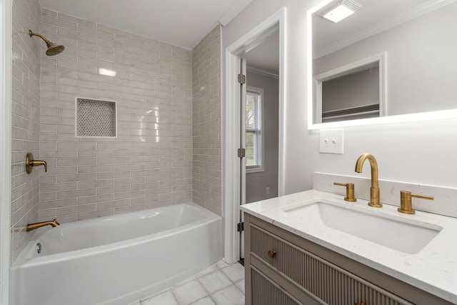 bathroom with vanity, crown molding, and tiled shower / bath combo