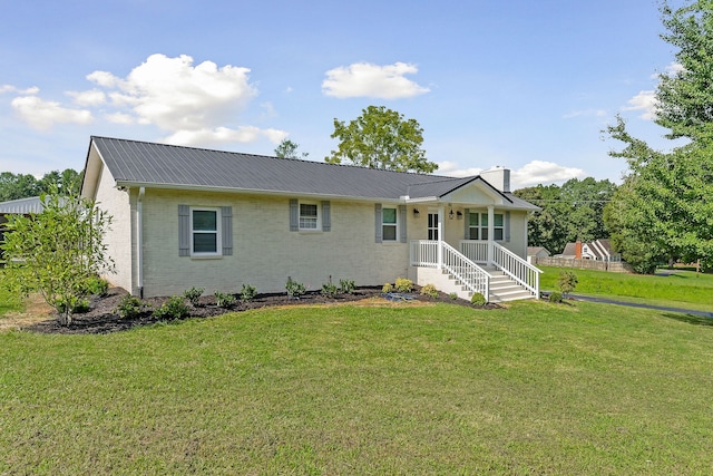 ranch-style home with a front lawn