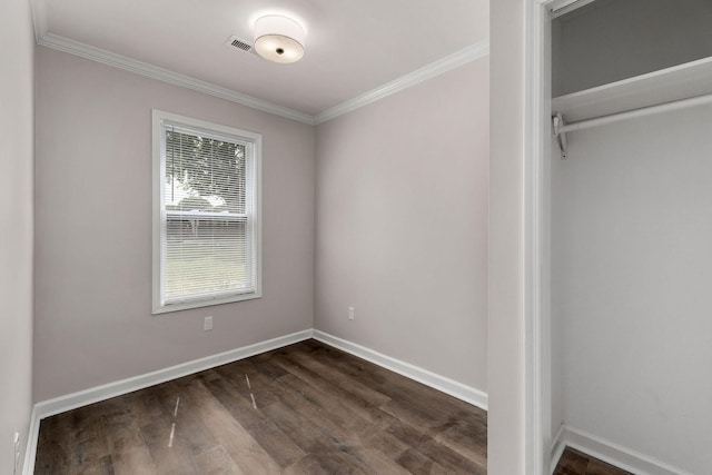 interior space with ornamental molding and dark wood-type flooring