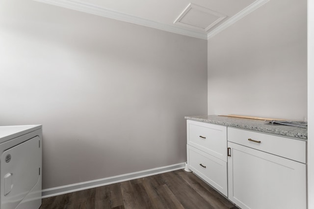 laundry area featuring washer / dryer, dark wood-type flooring, cabinets, and ornamental molding