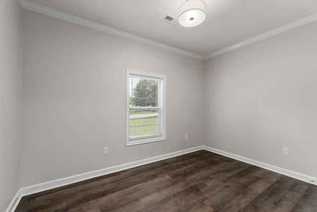 spare room with crown molding and hardwood / wood-style floors