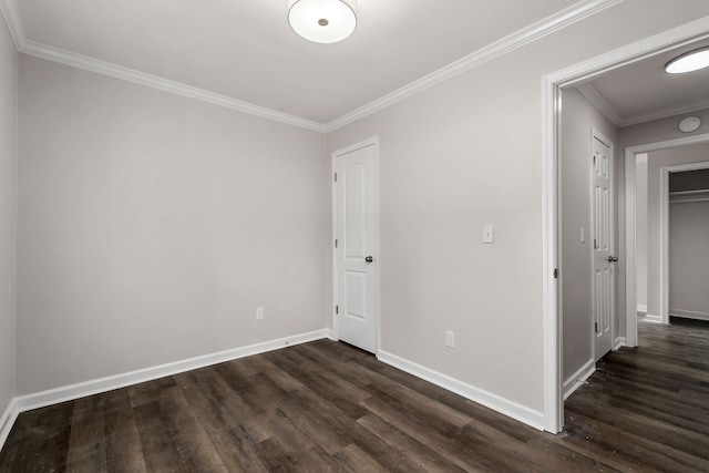 unfurnished room with dark wood-type flooring and ornamental molding