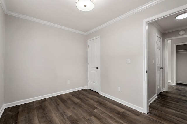 unfurnished room with dark wood-type flooring and crown molding