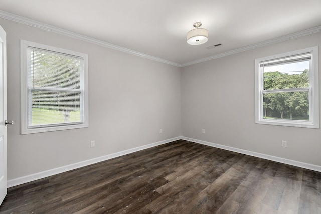 unfurnished room with a healthy amount of sunlight, hardwood / wood-style flooring, and crown molding