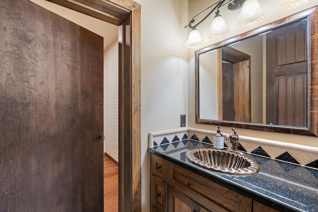 bathroom featuring vanity and hardwood / wood-style floors