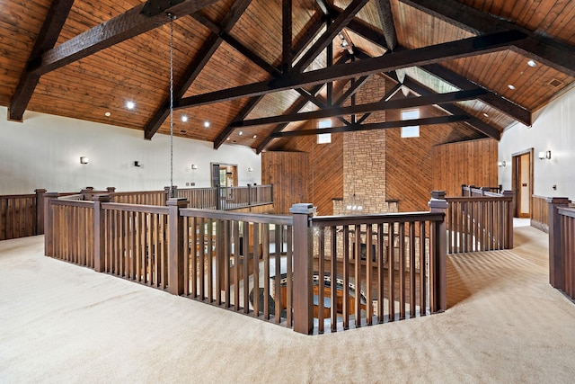 corridor featuring light carpet, wooden ceiling, and high vaulted ceiling