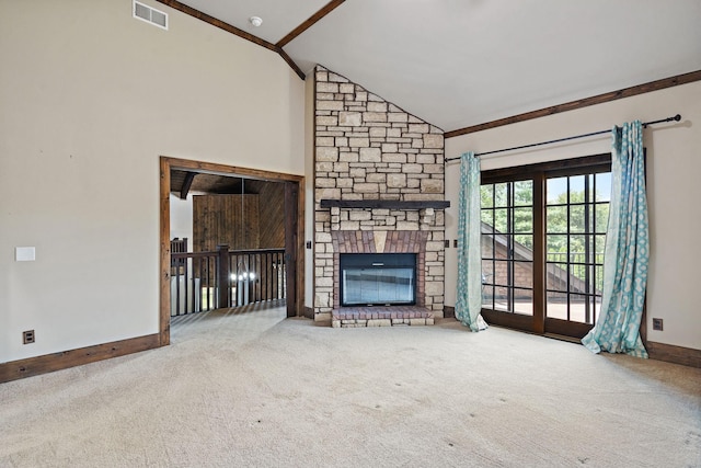 unfurnished living room with a stone fireplace, high vaulted ceiling, and carpet