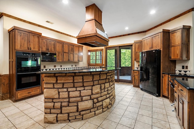 kitchen with ornamental molding, custom exhaust hood, black appliances, and a kitchen island