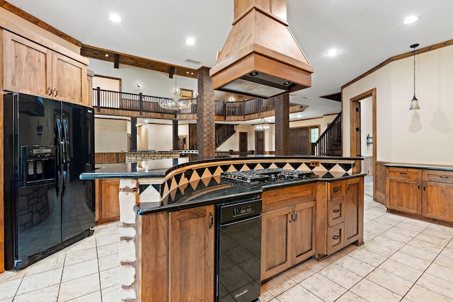 kitchen with premium range hood, a kitchen island, pendant lighting, a breakfast bar area, and black appliances