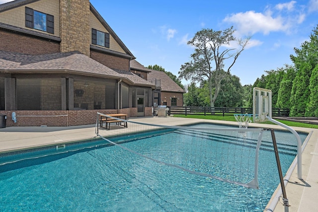 view of swimming pool with a patio area