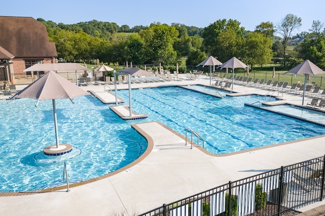 view of swimming pool with a patio