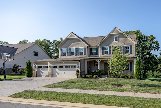 craftsman-style house with a garage and a front lawn