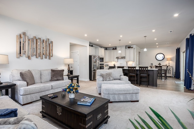 living room with light hardwood / wood-style floors