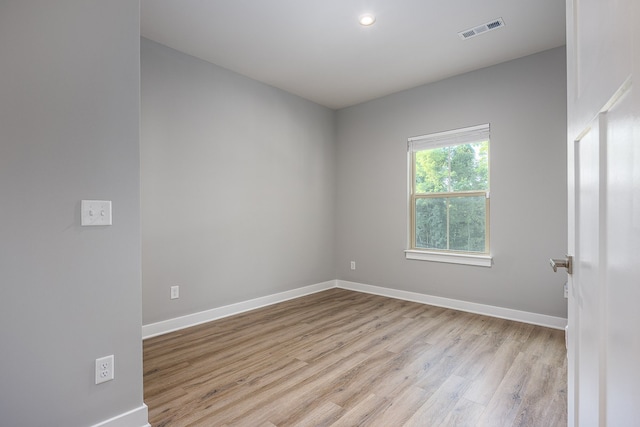 unfurnished room featuring light hardwood / wood-style floors