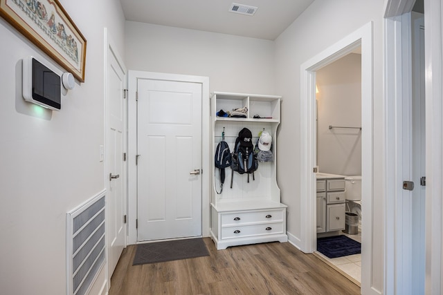 mudroom with hardwood / wood-style flooring