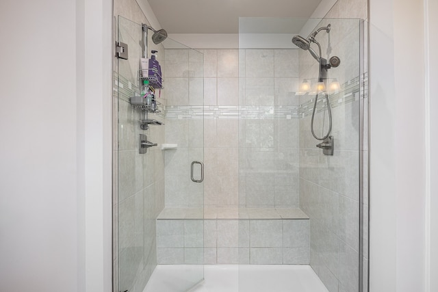 bathroom featuring a shower with shower door