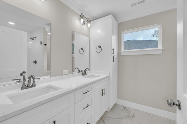 bathroom featuring vanity and tiled shower