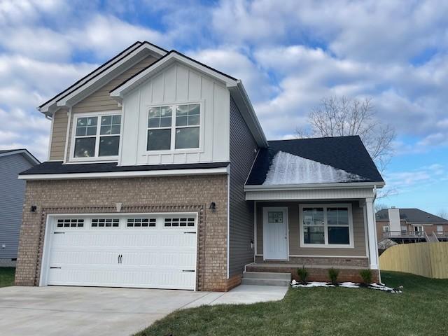 view of front facade with a garage and a front lawn