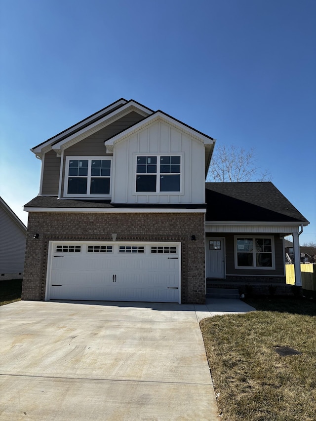 view of front of property with a garage and a front yard