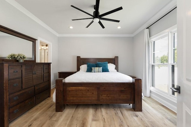 bedroom featuring light hardwood / wood-style flooring, ornamental molding, and ceiling fan