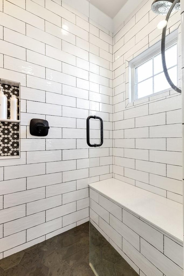 bathroom with a shower with shower door