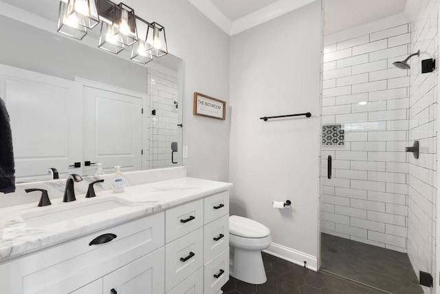 bathroom featuring crown molding, tile patterned flooring, vanity, a shower with shower door, and toilet