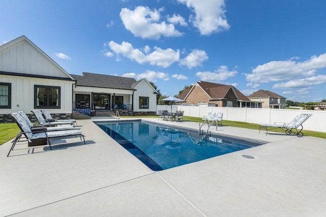 view of swimming pool featuring a patio area