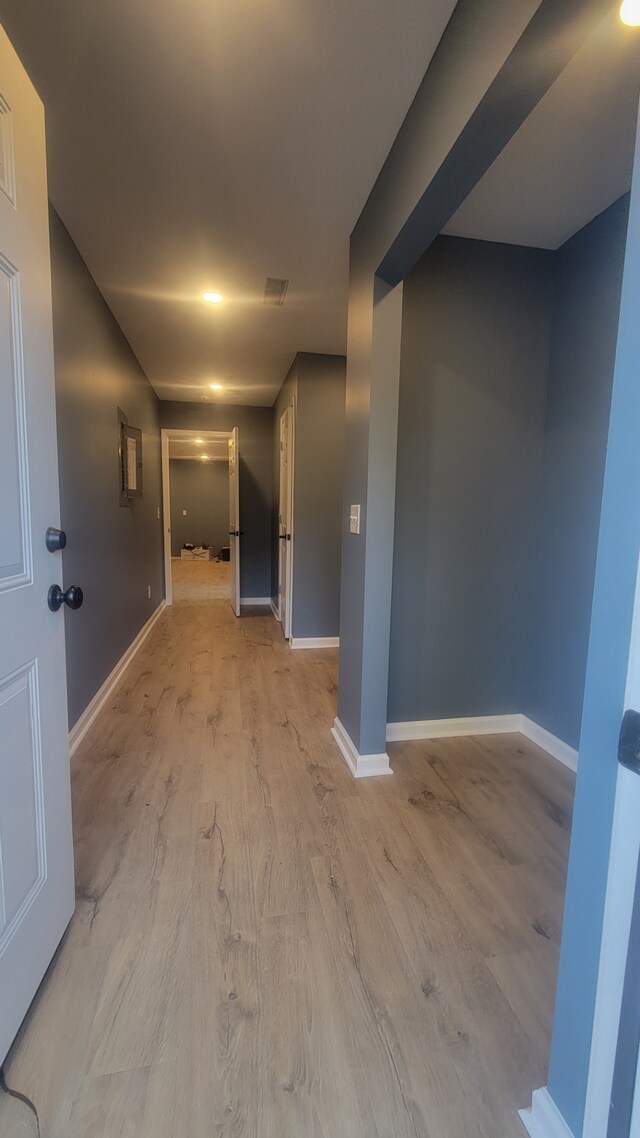 spare room with light wood-type flooring