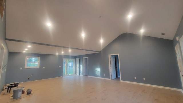 spare room with high vaulted ceiling