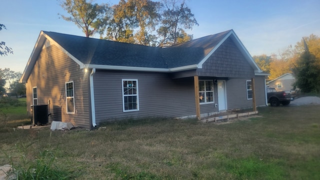 exterior space featuring a yard and central AC unit