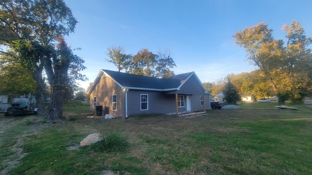 view of property exterior with a lawn