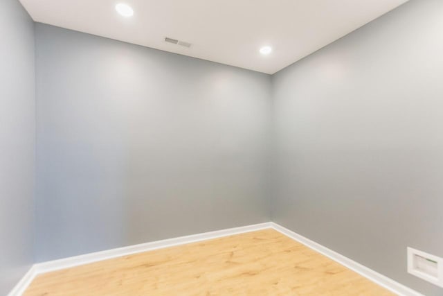 spare room featuring wood-type flooring