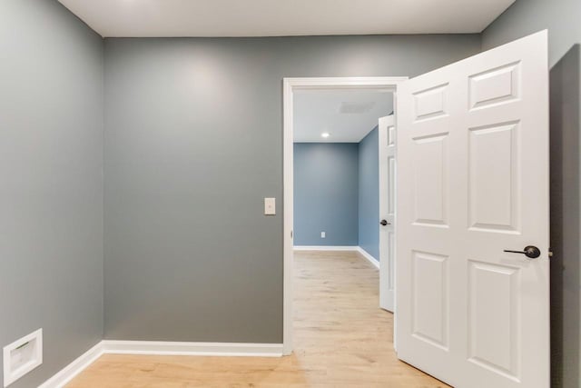 hall with light wood-type flooring