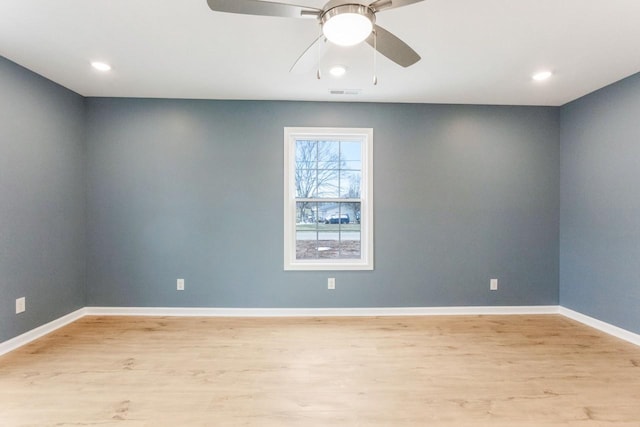 empty room featuring ceiling fan and light wood-type flooring