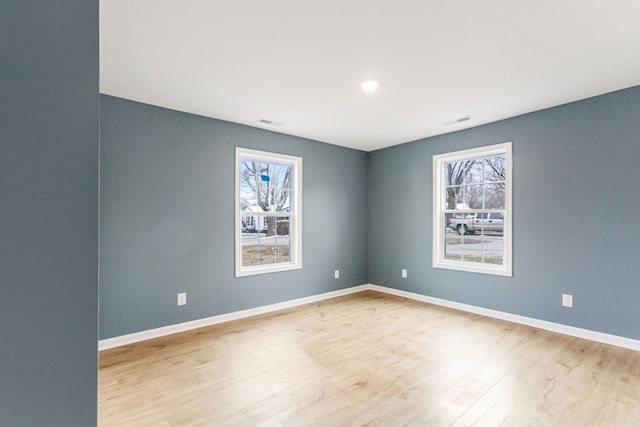 unfurnished room featuring light hardwood / wood-style flooring