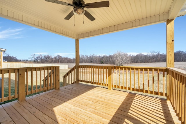 wooden terrace featuring a ceiling fan