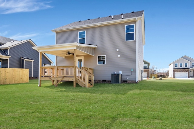 rear view of property with crawl space, a yard, fence, a wooden deck, and central AC