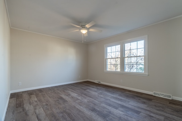 spare room featuring wood-type flooring, ceiling fan, and crown molding