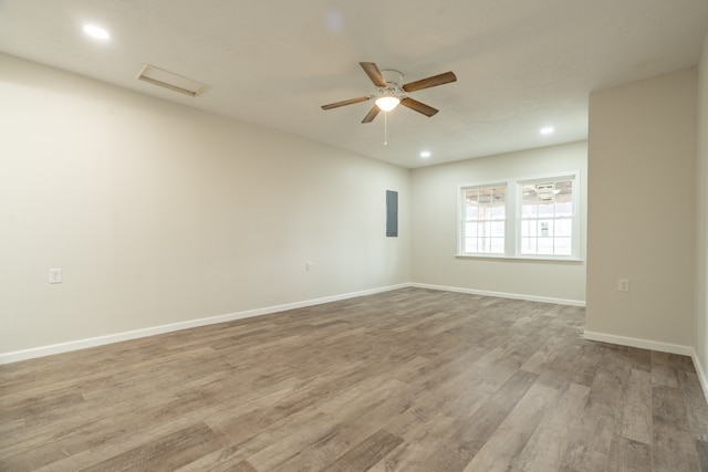 empty room featuring light hardwood / wood-style flooring and ceiling fan