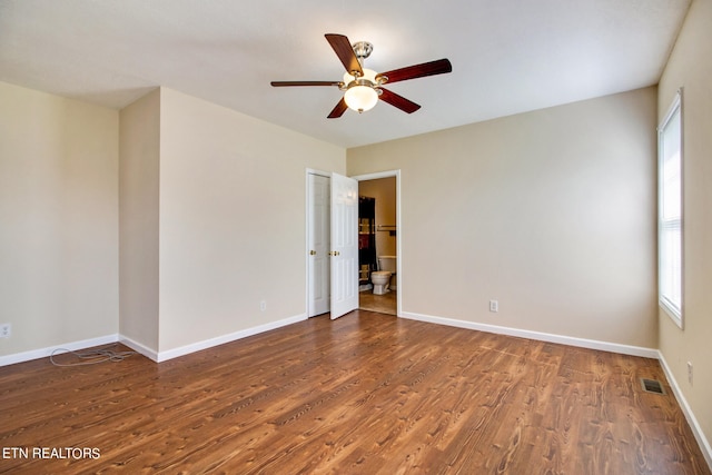 empty room featuring wood-type flooring and ceiling fan